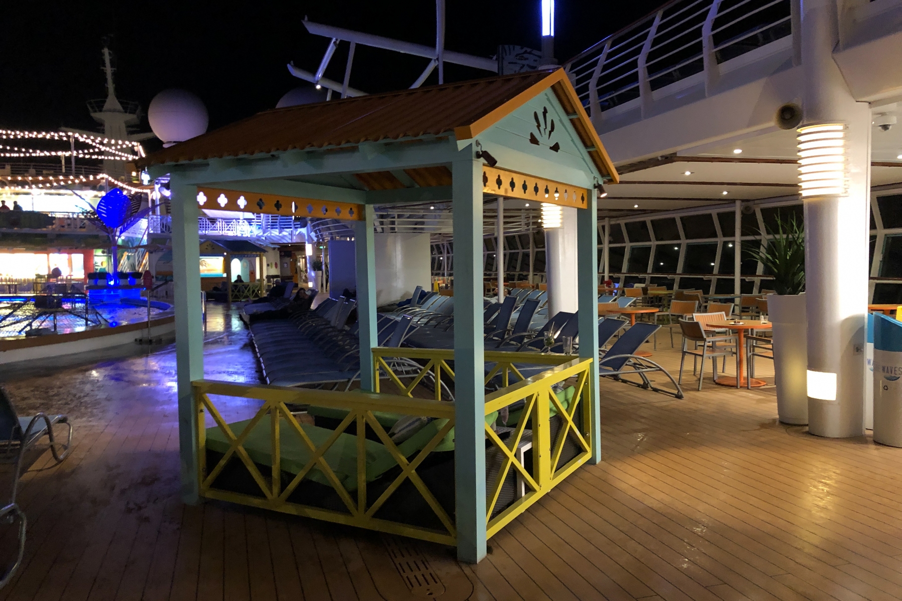 Navigator of the seas pool Deck at night on a cool rainy evening